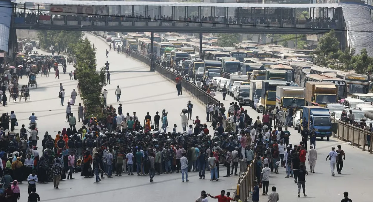 Garment workers block Uttara road for hours demanding unpaid wages