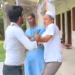 One teacher to another teacher
Beating, pulling the collar