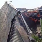 Locals set fire to the house of a relative arrested for murdering a couple with two children in Naogaon