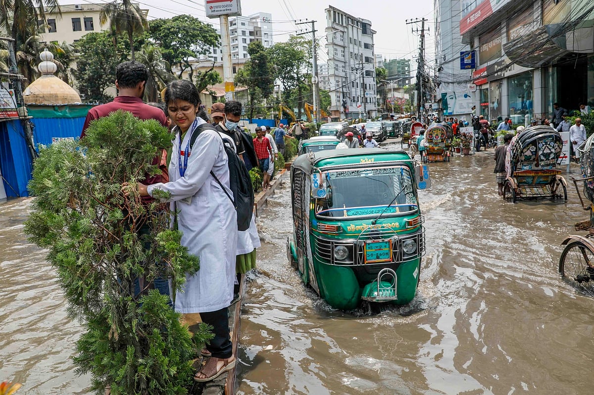 In Chittagong, due to light rain, there is water at Pramwarta intersection, pedestrians are suffering
