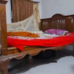 Fisherman Bashar sleeps on the couch of Puthia Rajbari