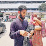 Twins in arms, one dead, the other measles