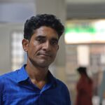 Alam runs the family by taking pictures on the beach, sells the camera for his daughter’s treatment