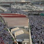 Eerie silence descends on millions gathered under open skies