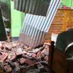 Four injured after building wall collapses onto tin-shed home during storm