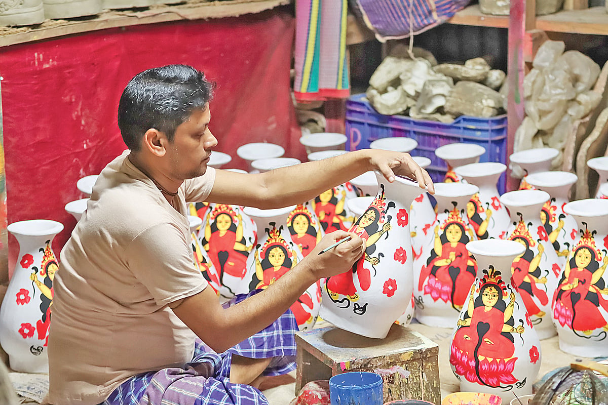 Barisal artisan preserves fading tradition of crafting clay vessels for Mansa Puja