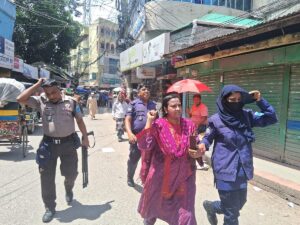 Businesswoman assaulted by mob while being escorted by police in Rajbari