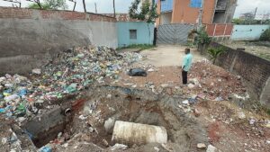 Dhaka North City Corporation excavates road in front of factory following official standoff