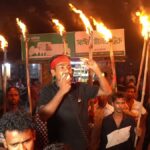 Political activists stage torchlight protest outside Rajshahi police station over alleged officer misconduct