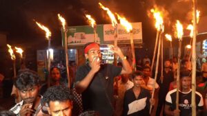 Political activists stage torchlight protest outside Rajshahi police station over alleged officer misconduct